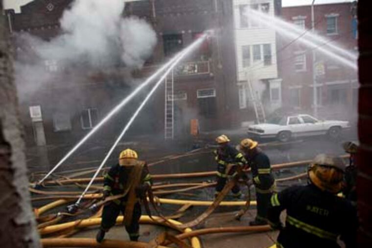 A four-alarm fire in South Philadelphia Monday, December 10, 2012 destroys the props the members of the Fralinger String Band had prepared for the Mummers Parade. DAVID SWANSON / Staff Photographer