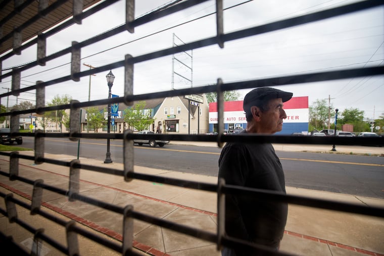 Jim DiAmore of Lipkin's Pharmacy is seen through the store's windows in Brooklawn, N.J. on May 1, 2020. The pharmacy had a soft closing on Saturday, May 2, after nearly 36 years of being owned by DiAmore. DiAmore and his wife, Karen, are beloved by their customers.