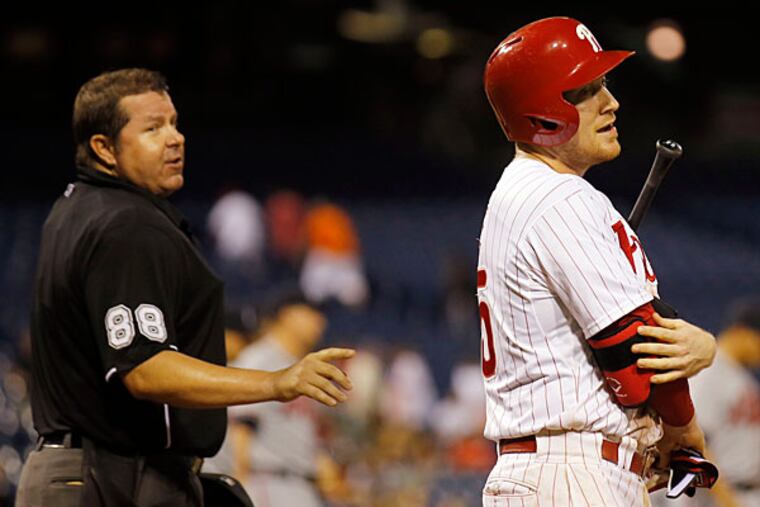 Cody Asche reacts after striking out looking to end the game against the Atlanta Braves.