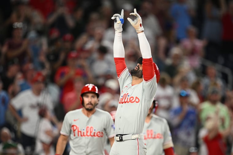 Derek Hill celebrates his two-run home run during the ninth inning on Wednesday.