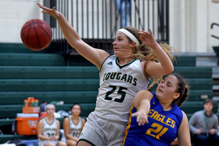 Schalick's Emily Einstein (#25) is fouled while shooting against Pennsville's April Hartman (right) February 5, 2019.