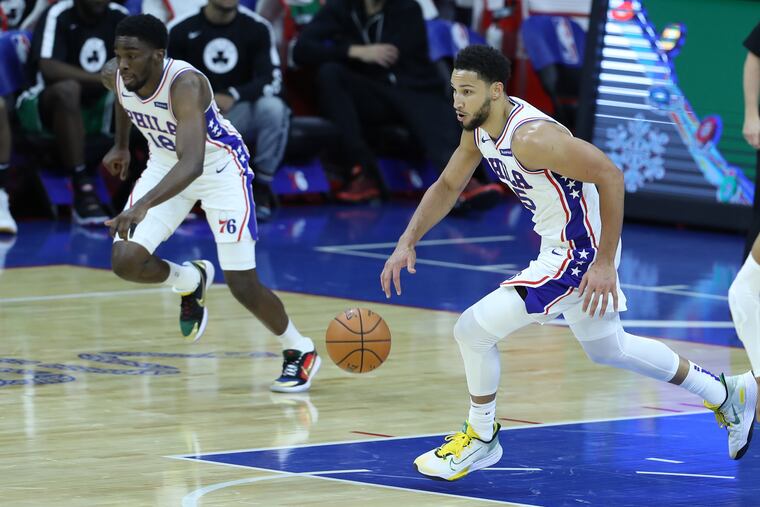 Ben Simmons (right) leads a fastbreak against the Celtics during a preseason game last week. Shake Milton is following.