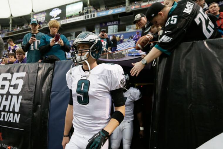 Eagles quarterback Nick Foles walks onto the field before an NFL football game between the Minnesota Vikings and the Philadelphia Eagles, Sunday, Dec. 15, 2013, in Minneapolis. (Charlie Neibergall/AP)