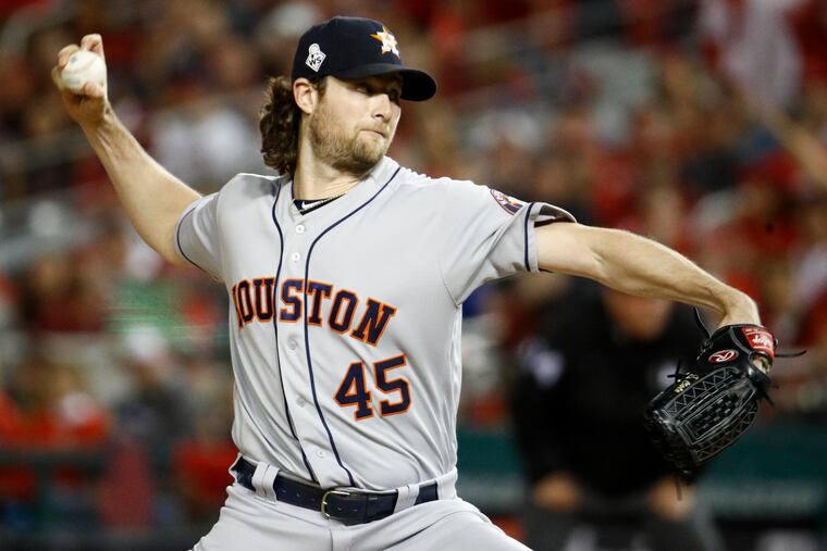 Houston Astros starting pitcher Gerrit Cole throws against the Washington Nationals during the first inning of Game 5 of the World Series.