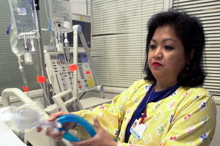 Lovely R. Suanino, a respiratory therapist at Newark Beth Israel Medical Center in Newark, N.J., demonstrates setting up a ventilator in the intensive care unit of the hospital. U.S. hospitals bracing for a possible onslaught of coronavirus patients with pneumonia and other breathing difficulties could face a critical shortage of mechanical ventilators and health care workers to operate them.
