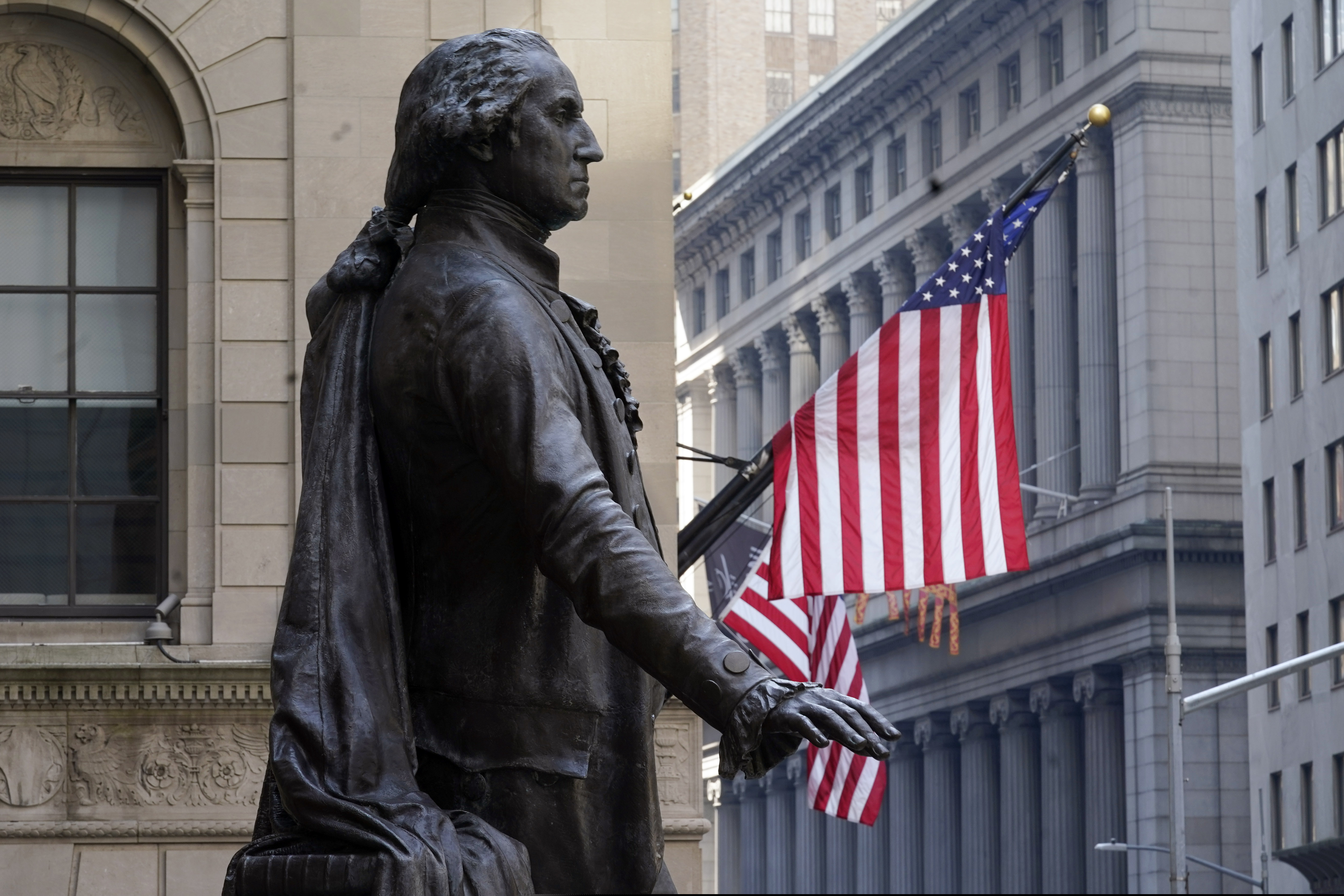 The Federal Hall statue of George Washington overlooks the New York Stock Exchange in 2021.