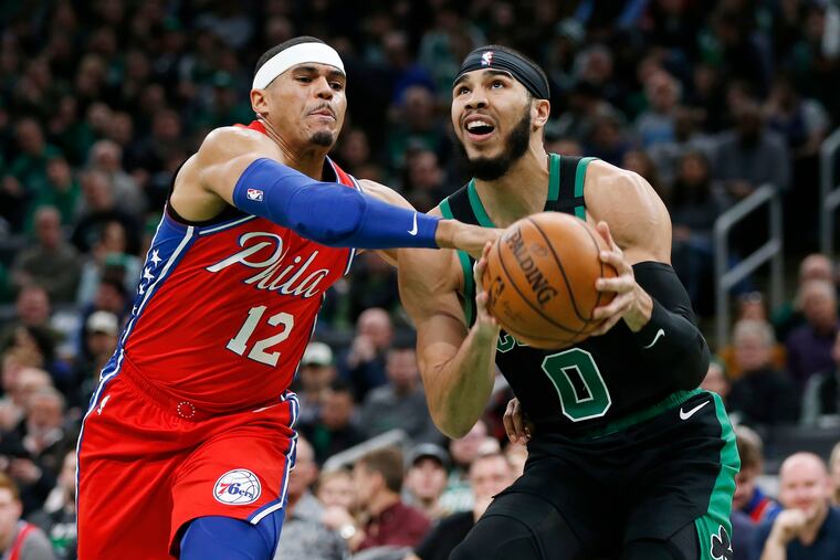 The 76ers' Tobias Harris fouling the Celtics' Jayson Tatum (0) during the first half Saturday night.