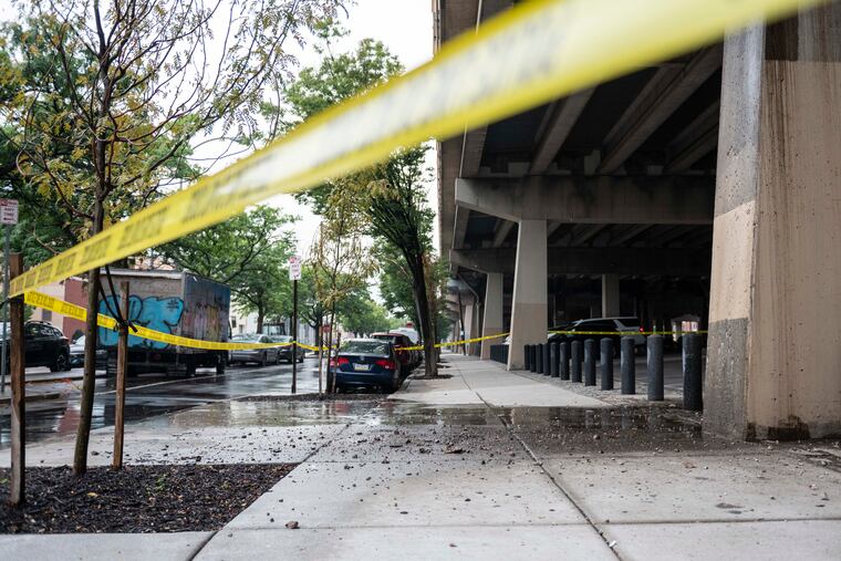 Debris falls from I-95 South at Front Street and Dickinson Street on Wednesday, July 19, 2023. Police blocked off part an overpass.