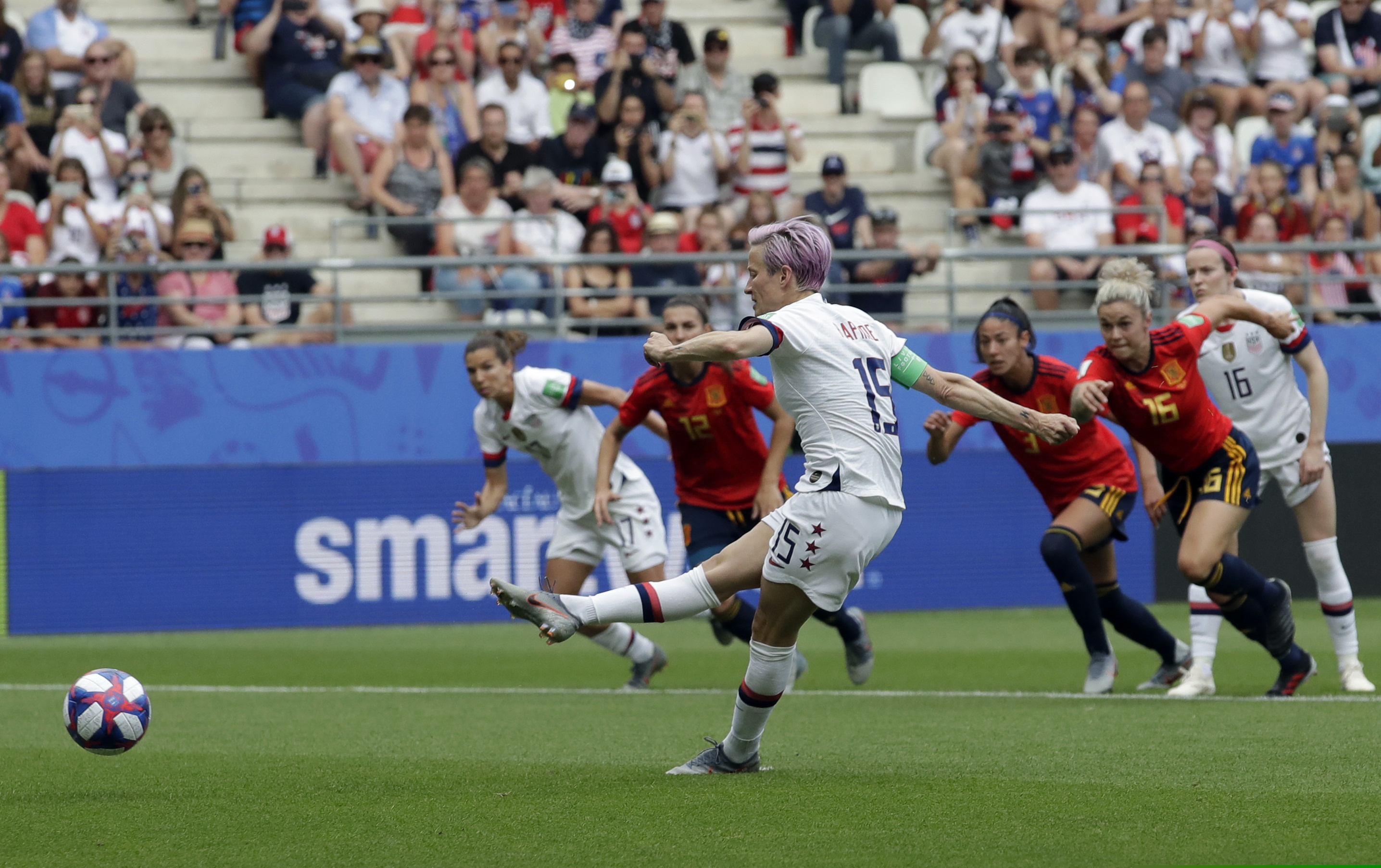 Megan Rapinoe scores the opening goal from a penalty spot during Monday's game against Spain in Reims.
