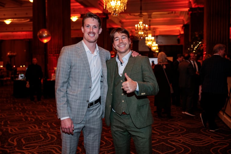 Flyers Nick Seeler (left) and Bobby Brink pose on the red carpet of the third annual Flyers Charities Casino Night.