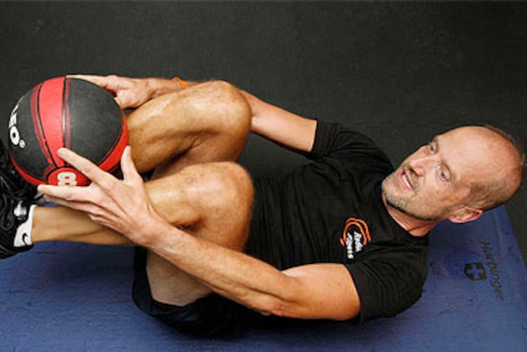 Peter Hopkins does crunches. He once weighed 300 pounds and had to take insulin and blood-pressure meds. "I was never involved in sports. I never exercised in my life." Now, he's drug-free and weighs 180. (Michael S. Wirtz / Staff Photographer)