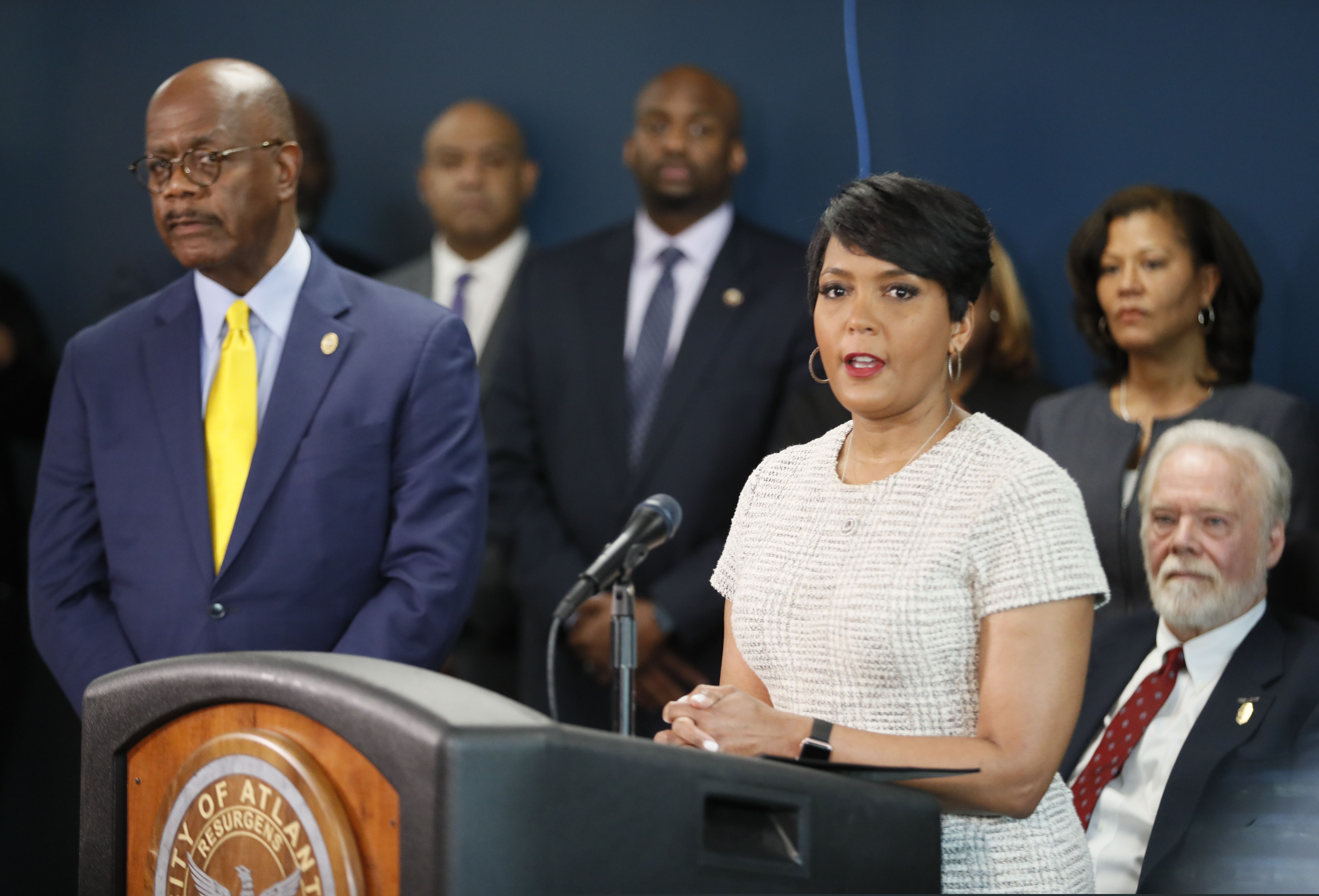 This March 2019 photo shows Atlanta Mayor Keisha Lance Bottoms (podium), standing next to Fulton County District Attorney Paul Howard.