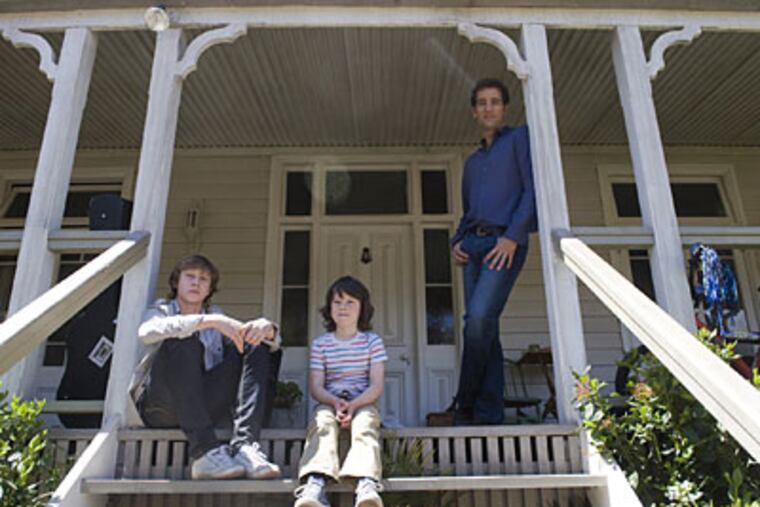 George MacKay (left), Nicholas McAnulty (center) and Clive Owen must learn how to cope following the death of Owen's wife.