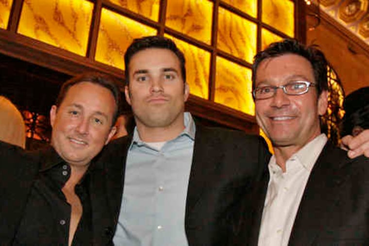 The Union Trust restaurant holds a private launch with local celebrities including (from left) Philadelphia Style magazine publisher John Colabelli and meteorologists Doug Kammerer of CBS3 and John Bolaris of Fox29. The party was last night; the steak house, at 717 Chestnut St., is scheduled to open to the public Friday.