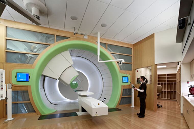 A Radiation Oncology tech in one of the four gantry rooms at the Roberts Proton Therapy Center. Approximately 75,000 square feet in size, the Center is located in a mostly underground building interconnected to the Perelman Center for Advanced Medicine. (Photo courtesy of Penn Medicine)