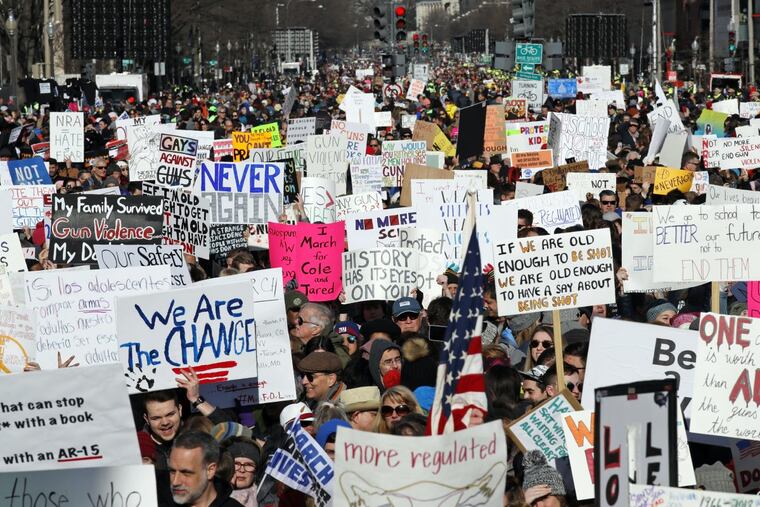 Crowds of people hold signs on Pennsylvania Avenue at the "March for Our Lives" rally in support of gun control, Saturday, March 24, 2018, in Washington.