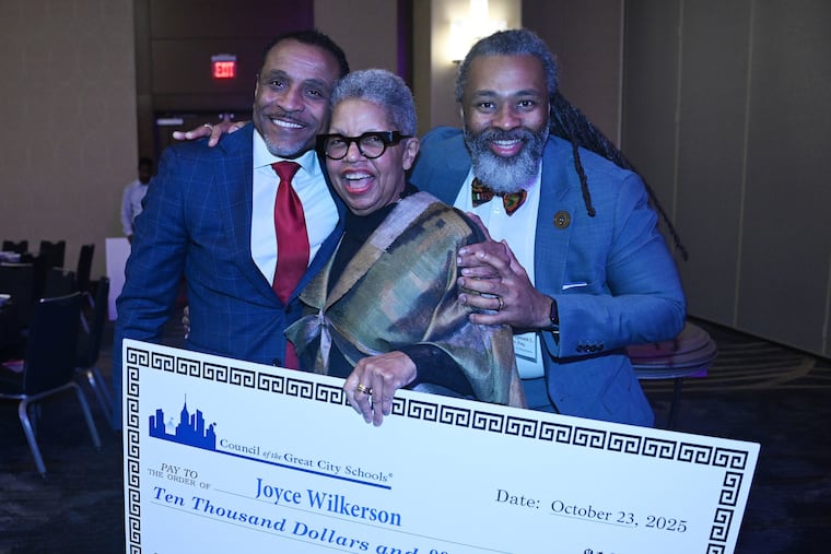 Joyce Wilkerson, Philadelphia's longest-serving school board member, received the 2025 Urban Educator of the Year award from the Council of Great City Schools, a national organization whose annual conference is being held in Philadelphia this year. Here, Wilkerson (center) is shown with Superintendent Tony B. Watlington Sr. and school board president Reginald Streater.