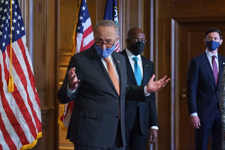 Senate Majority Leader Chuck Schumer, D-N.Y., left, at a news conference Thursday.