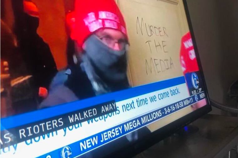 The FBI says this screen shot of TV news coverage, included in court filings, shows Donald Smith of Lindenwold moving through the Capitol as rioters stormed the building on Jan. 6