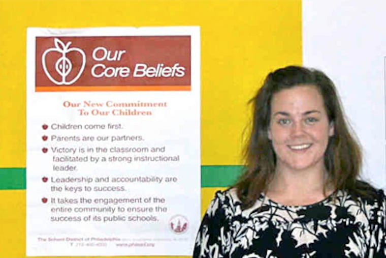 Hope Moffett in the basement classroom - complete with inspirational signs - where she awaits her "investigatory conference."