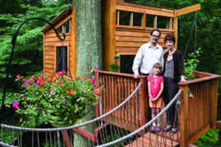 at the elegant treehouse on their Media property. The bouncy plank bridge connects to the family deck.