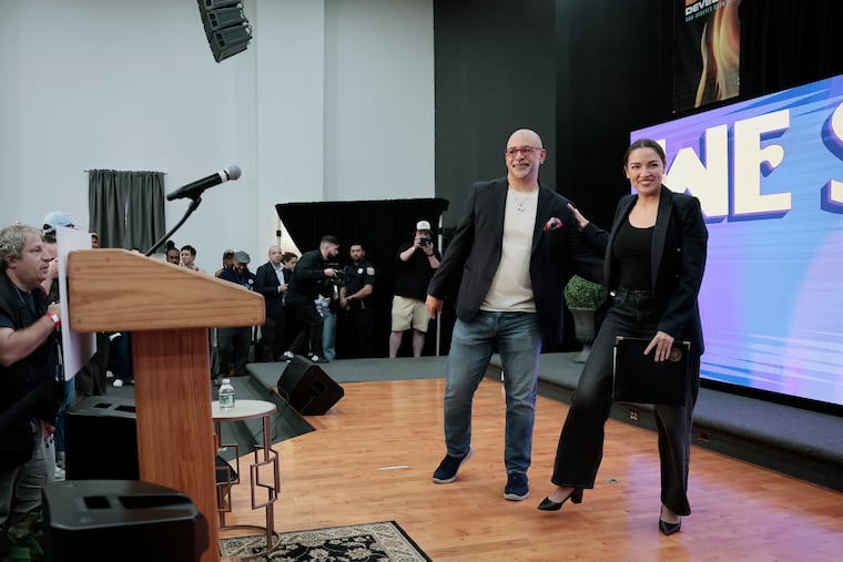 State Rep. Chris Rabb (left) and Rep. Alexandria Ocasio-Cortez during a rally, in support of Rabb’s progressive campaign for Pennsylvania’s 3rd Congressional District, at the Garden of Prayer church in the Strawberry Mansion section of Philadelphia on May 15.