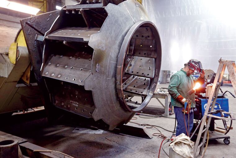 At work on an industrial ventilation system in Butler County, Pa. Manufacturing in Pennsylvania is on the upswing but struggles in New Jersey. Three industry challenges cited at a talk here: Business regulation, taxes, and a coming labor shortage.