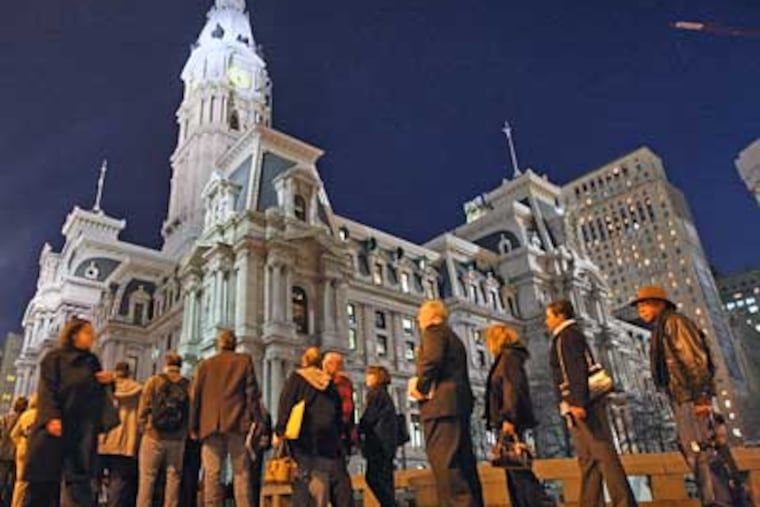Throngs of Philadelphians wait in line outside City Hall to shake Michael Nutter's hand after he was sworn in as mayor last January. (Michael Bryant / Staff File Photo)