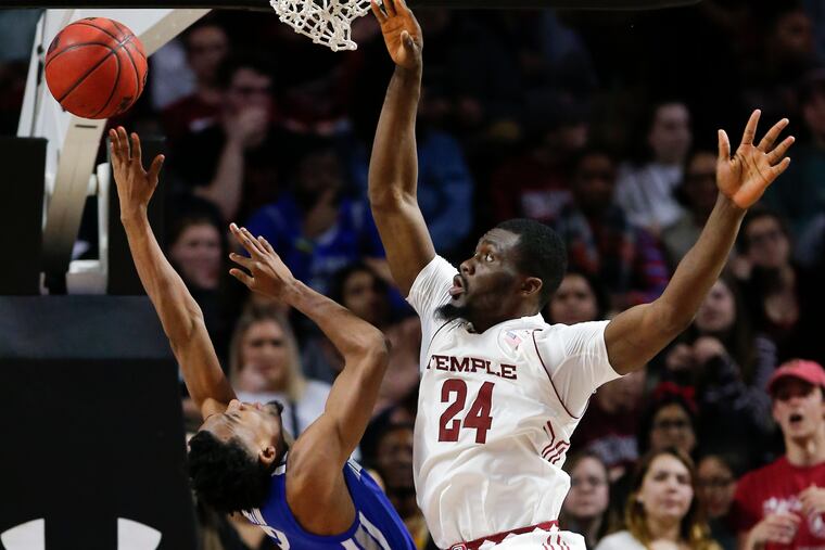 Temple center Ernest Aflakpui defending against Memphis guard Jeremiah Martin on Jan. 24.