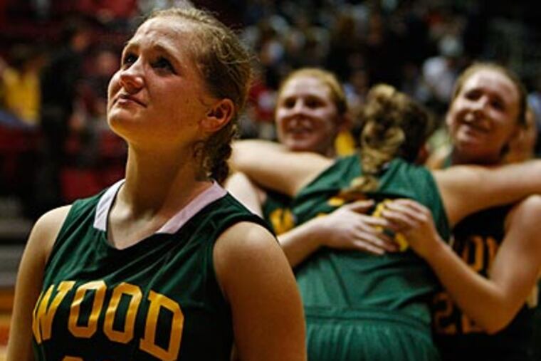 Archbishop Wood's Steph Keyes waits to cut down the net as her teammates celebrate. (Ron Cortes/Staff Photographer)
