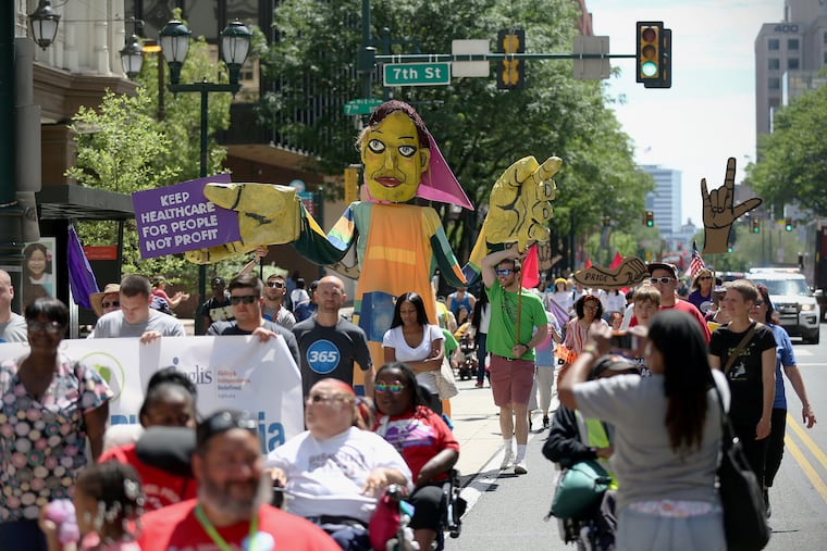 People participate in the annual Disability Pride Parade on Market Street in Center City in 2019. The parade celebrates and promotes visibility for people with disabilities.