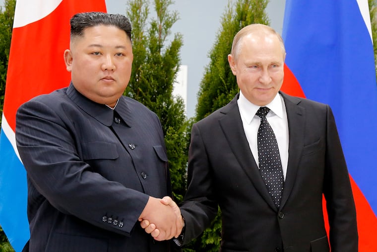 Russian President Vladimir Putin, right, and North Korea's leader Kim Jong Un shake hands during their meeting in Vladivostok, Russia, in 2019.