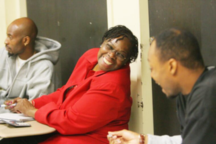 Linda Stewart shares a laugh with fellow students Michael Carroll (left) and Jamahl Ephraim (right.)