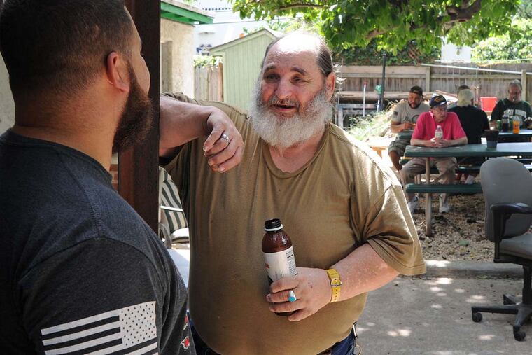 John Wiley (right), who served in the Navy in 1970-75, talks with Veterans Group staffer Chris Jimenez, who was in the Army in 2001-05.