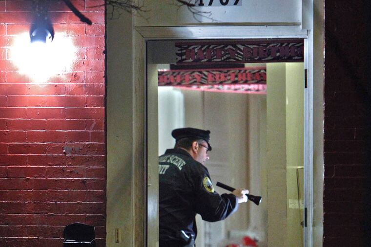 Police investigate the crime scene on N. 27th Street near Cecil B. Moore Avenue in North Philadelphia, Sunday Oct. 27, 2013, after a man was fatally wounded by gunfire. (Joseph Kaczmarek / For the Daily News)