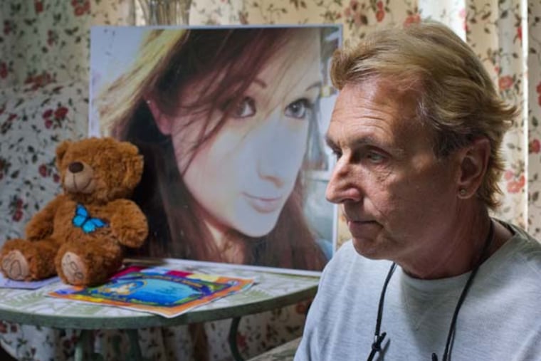 Andy Rumford and a photo of his daughter from 2012 at age 22. Kacie died of a heroin overdose this past March. ( DAVID M WARREN / Staff Photographer )