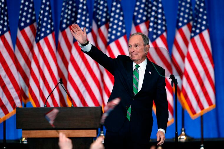 Former Democratic presidential candidate Mike Bloomberg waves to supporters as he announces the suspension of his campaign and his endorsement of Vice President Joe Biden on March 4.