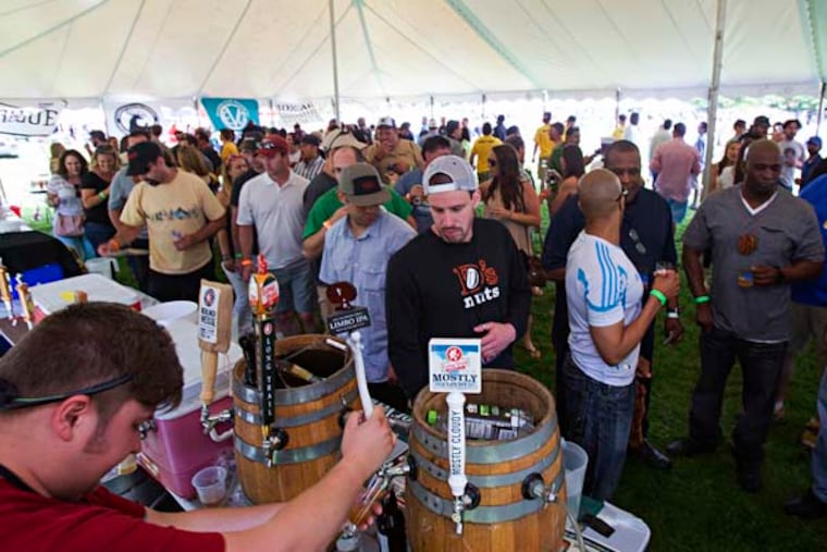 Saturday May 31 2014 Philly Beer Week kicks off at the Great Beer Expo , at the Navy Yard on Saturday. Here, beer lovers under the big tent.. ( ED HILLE / The Philadelphia Inquirer )
