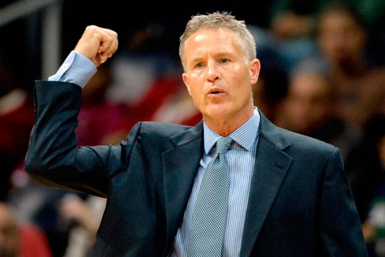76ers head coach Brett Brown calls a play in the first half of their NBA basketball game against the Atlanta Hawks on Friday, Nov. 15, 2013, in Atlanta. (David Tulis/AP)
