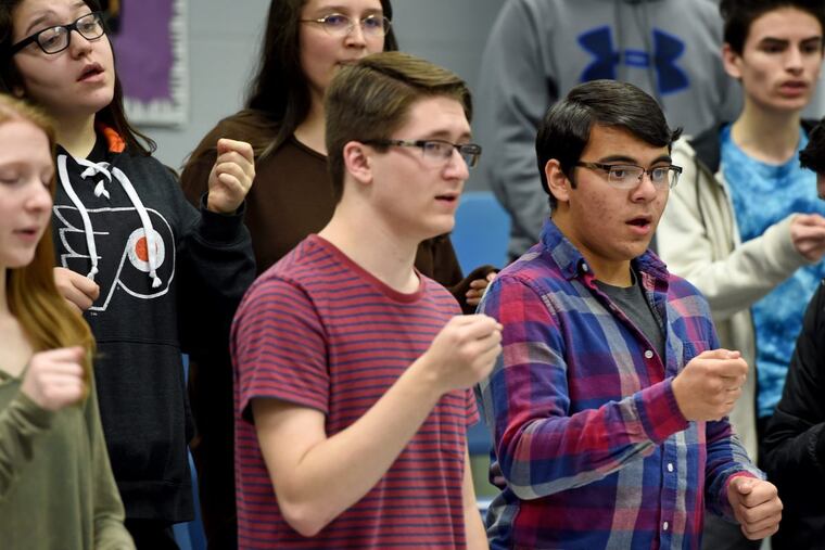 Cherry Hill High School West students Griffin Rice (left) and Tomas Saed sing as the Phantom (there are two casts) as they rehearse their production of the Phantom of the Opera. The arts are big in Cherry Hill, where the district’s two high schools put on elaborate productions twice a year. Across the region, arts programs have struggled in some public schools in lean economic times. Schools have had to get creative in fundraising or turn to parents.