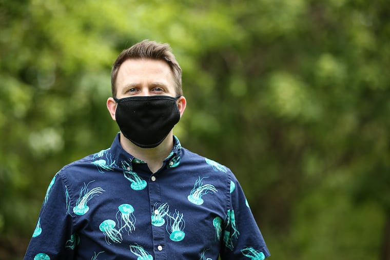 Ryan Nagle filed an unemployment claim in March but didn't get his first check till June. While he waited, has depleted his savings. Nagle poses for a portrait in Haddonfield, N.J. on May 20, 2020.