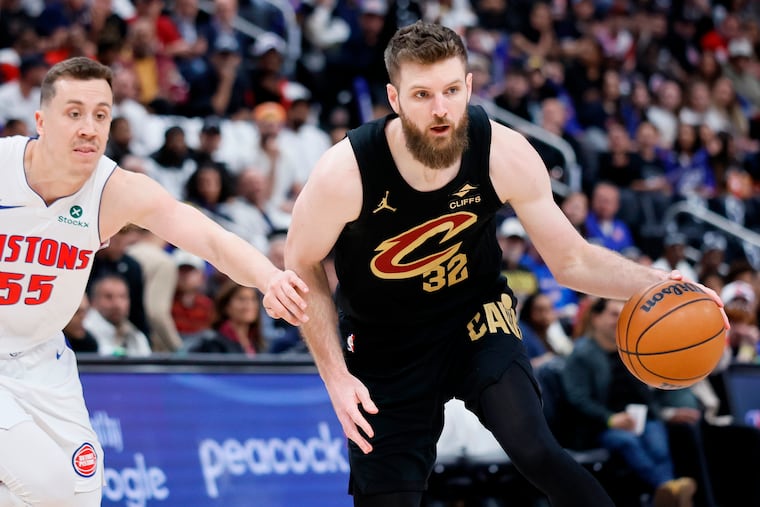 Cleveland Cavaliers forward Dean Wade (32) is guarded by Detroit Pistons forward Duncan Robinson (55) during the first half in Game 1 of a second-round NBA playoffs basketball series Tuesday, May 5, 2026, in Detroit. (AP Photo/Duane Burleson)