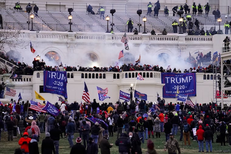 A mob of Trump supporters storm the Capitol in Washington on Wednesday, Jan. 6 2021.