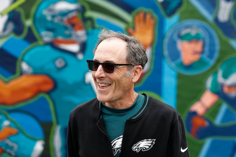 Muralist David McShane walks in front of the new mural during the dedication of the Super Bowl LIX mural at Spike’s Trophies on Tuesday, June 17, 2025 in Philadelphia. The mural is an addition to the existing City of Champions mural series by David McShane.