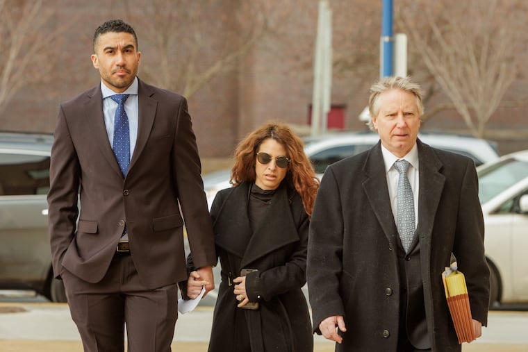 Niko Rodriguez, a former employee with Local 98 of the International Brotherhood of Electrical Workers, arrives at the U.S. Courthouse in Reading on Thursday. At right is defense attorney Paul Hetznecker.