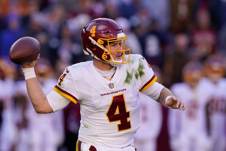 Washington Football Team quarterback Taylor Heinicke (4) during the first half of an NFL football game against the Dallas Cowboys, Sunday, Dec. 12, 2021, in Landover, Md. (AP Photo/Alex Brandon)