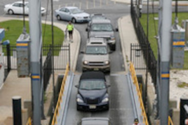 Cars pull onto the MV Cape May at the Cape May terminal. After trying to upgrade service to luxury tastes, the Delaware River and Bay Authorityis reversing course to meet what seems to be a demand for fewer frills.