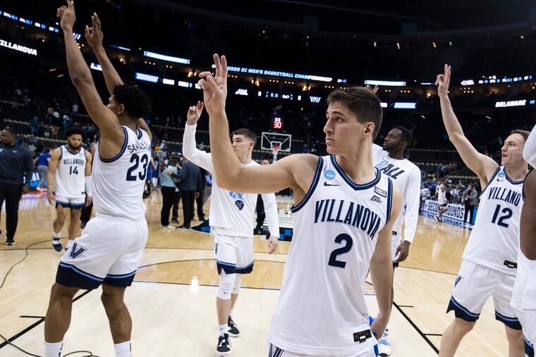 Collin Gillespie, center, and Villanova teammates acknowledge the Nova fans after their victory against Delaware in the NCAA Tournament.