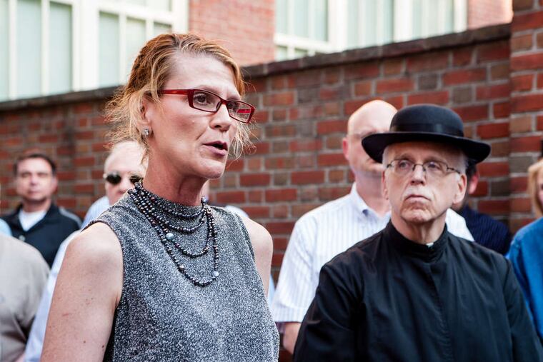 Celeste Morello with the Rev. Daniel Ruff, dressed in 1700s priestly garb, at the dedication of a historic marker outside Old St. Joseph's Church on Walnut Street.