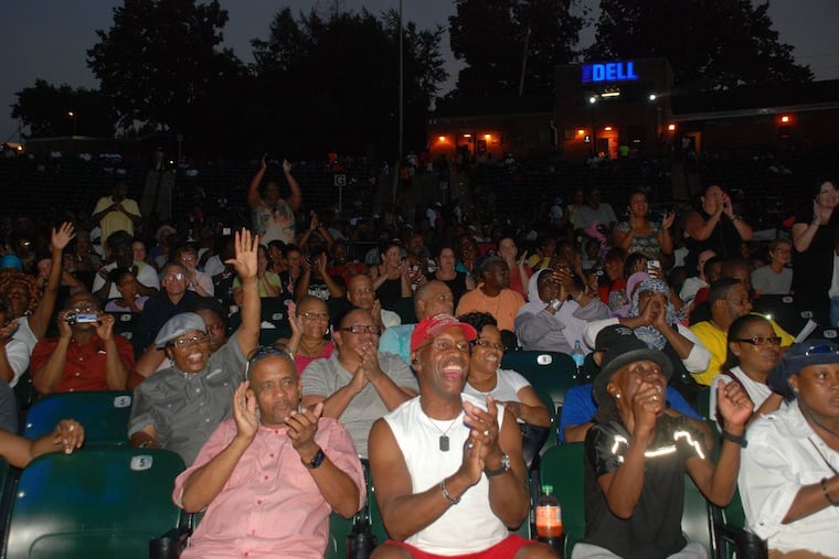 Audience members cheer for singers in the Recovery Idol competition, a local citywide singing competition for people in drug addiction recovery, which kicks off in Point Breeze on April 19, 2019.